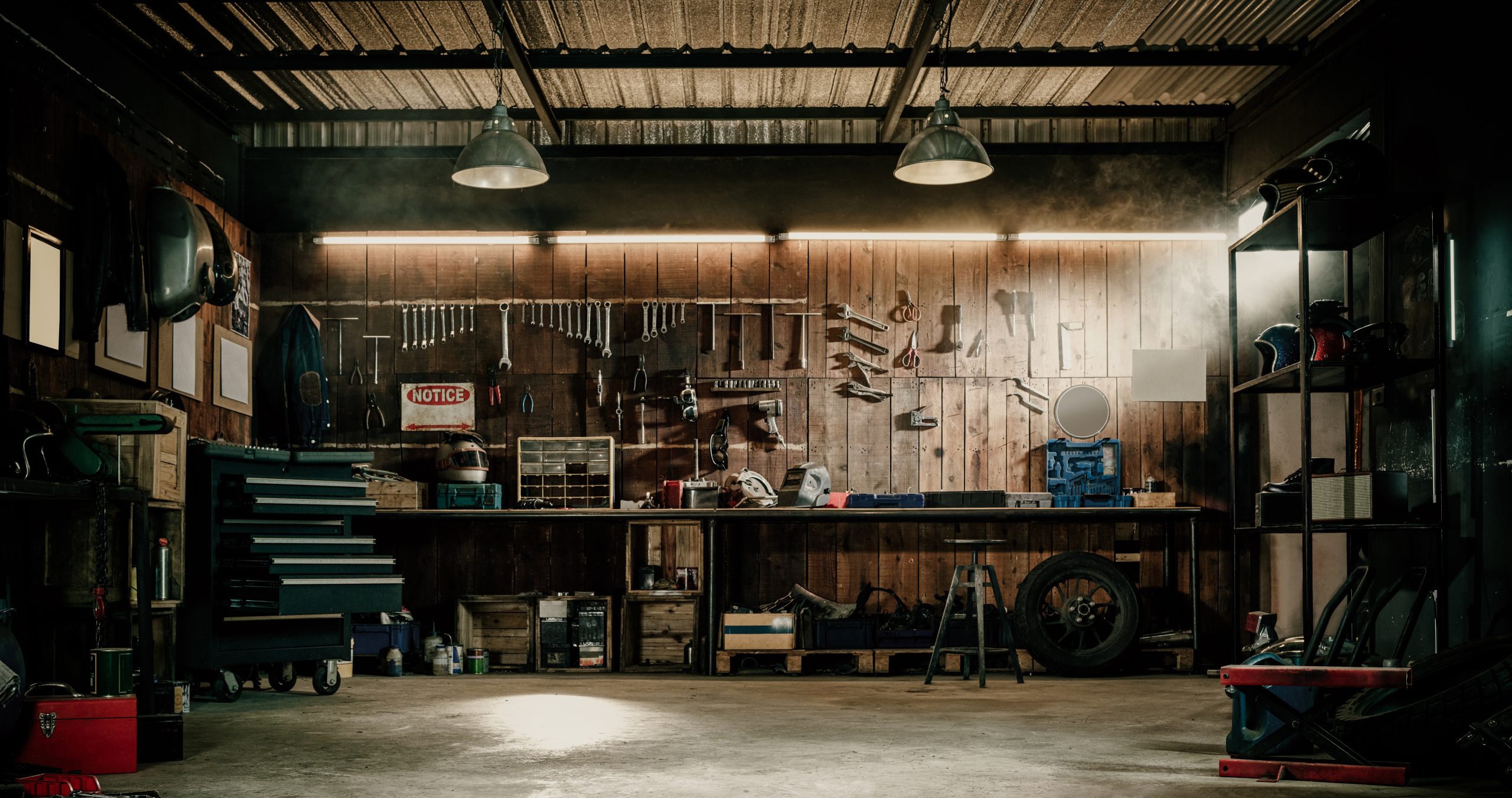 Workshop scene. Old tools hanging on wall in workshop, Tool shel